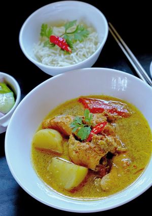 A picture of Chicken Thai Yellow Curry with Ajard Cucumber Relish Sauce.