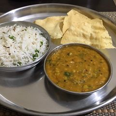 A picture of Dal tadka & jeera rice.
