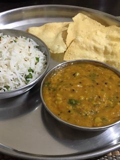 A picture of Dal tadka & jeera rice.
