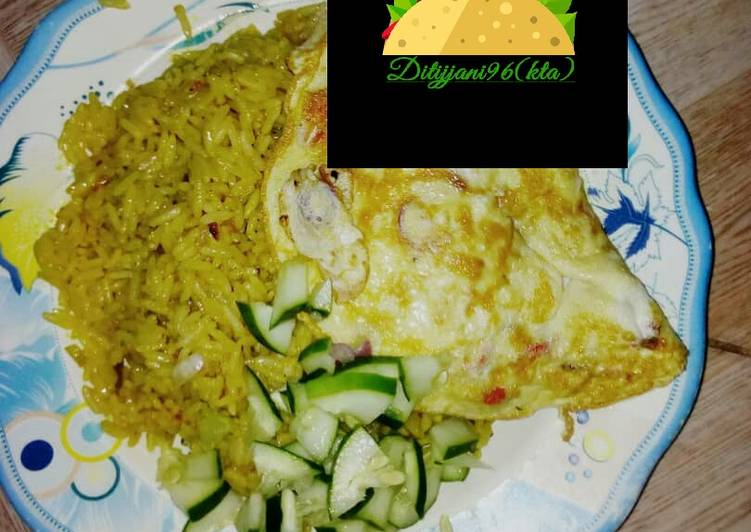 Jallof rice with omelette and cucumber