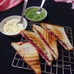 A picture of Cheese spread vegetable sandwich.