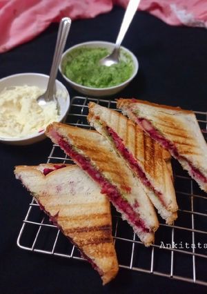 A picture of Cheese spread vegetable sandwich.