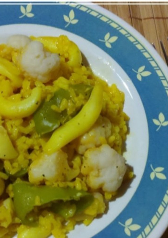 Una foto de Risotto a la cerveza con sepia y coliflor