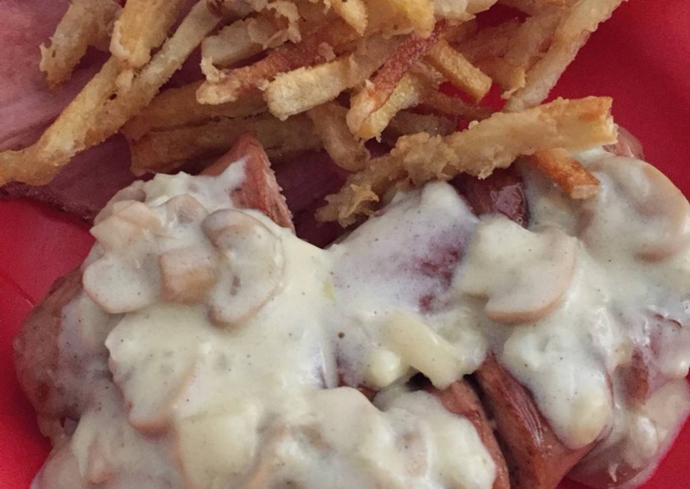 Bratwurst with mushroom cream sauce (+ bacon & french fries)