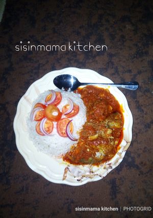 A picture of White rice with fish stew.