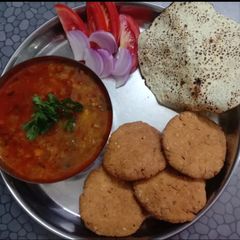 A picture of Kathiyawadi Special Chapdi Undhiyu - A dinner thali.