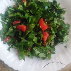 A picture of Spinach tomato salad.