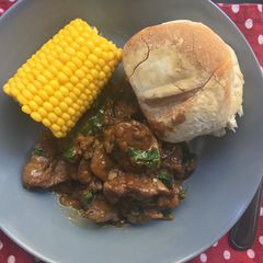 A picture of Peri-Peri chicken livers with sweetcorn and Portuguese rolls.