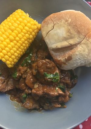 A picture of Peri-Peri chicken livers with sweetcorn and Portuguese rolls.
