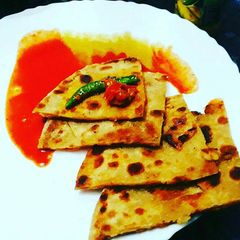 Aalu chaat paratha A picture of Aalu chaat paratha.