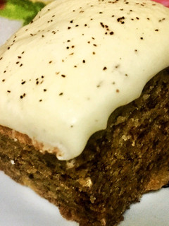 A picture of Banana cake with vanilla frosting.