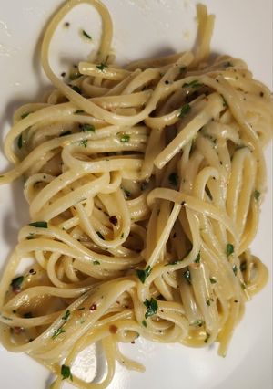 A picture of Pasta with garlic and parsley.