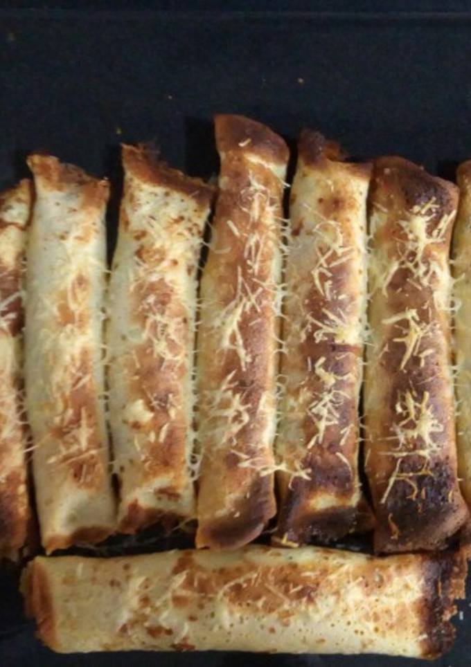 Una foto de Canelones de espinaca y ricota con salsa blanca