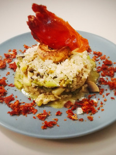 A picture of Vegetable Risotto with Manchego Cheese and Crispy Ham.