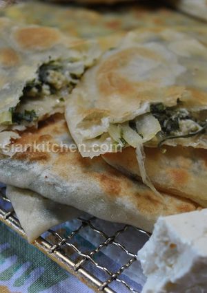 A picture of Stuffed Flat Naan Bread (Kelane/Bolani)نان کلانه.
