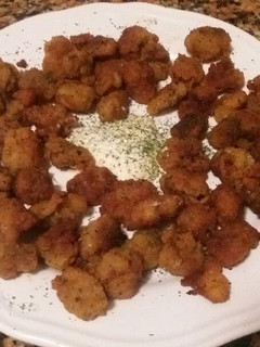 Una foto de Mollejas de pollo empanadas con oli-oli