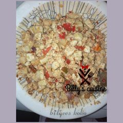 A picture of Tofu with egg and sauce.