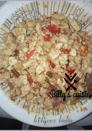 A picture of Tofu with egg and sauce.