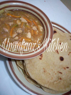 A picture of Roti and veggie soup.