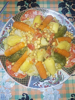 A picture of Moroccan Couscous with Vegetables and Chicken.