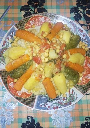 A picture of Moroccan Couscous with Vegetables and Chicken.