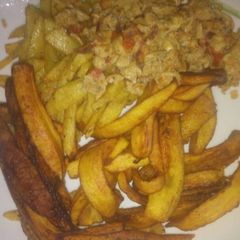 A picture of Irish potatoes with fried eggs.