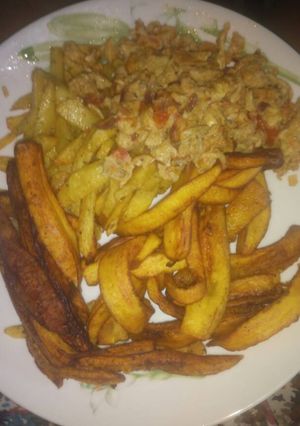 A picture of Irish potatoes with fried eggs.