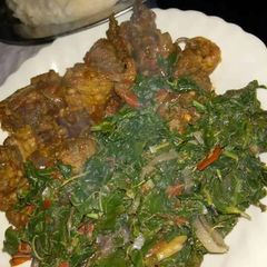 Ugali with fry beef and spinach A picture of Ugali with fry beef and spinach.