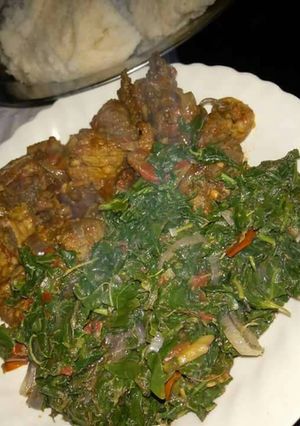 A picture of Ugali with fry beef and spinach.
