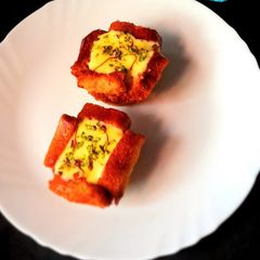 A picture of Kesar Pista Custard In Rusk Shahi Tukda Bowl.
