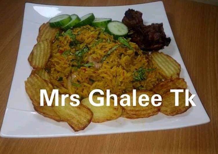 Jallof rice with chips and fry meat