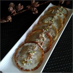 A picture of Sweet potato Malpua with Rabri.