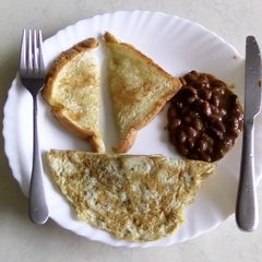 Red beans with toast and egg omelette A picture of Red beans with toast and egg omelette.