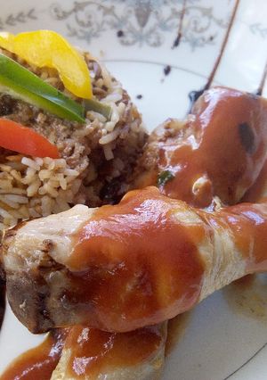 A picture of Chinese Stir fried Rice with stewed drumsticks.