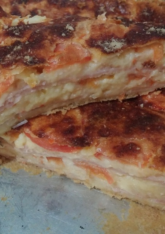 Una foto de Torta Fainá de Jamón, Queso y Tomate, en licuadora