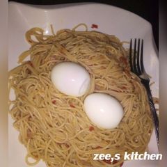 A picture of Superghetti jellof with boiled egg.
