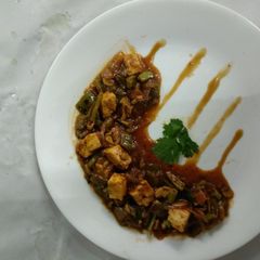 A picture of Chilli paneer in black bean sauce.