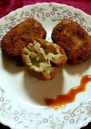 A picture of Poha potato patties with cheese.