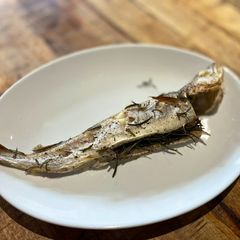 A picture of Oven roasted whiting with rosemary and lemon.