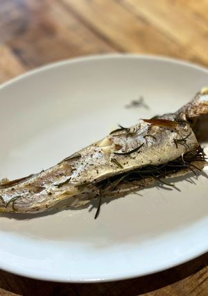 A picture of Oven roasted whiting with rosemary and lemon.