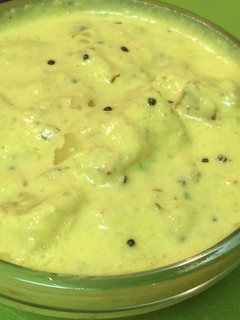A picture of Pineapple Pachadi ( Pineapple in Coconut- yogurt sauce).