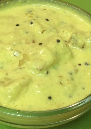 A picture of Pineapple Pachadi ( Pineapple in Coconut- yogurt sauce).