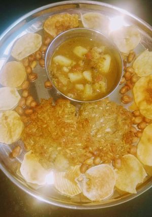 A picture of Lauki kuttu poori with aloo curry.