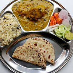 A picture of Punjabi Kadhi Pakoda Thali.
