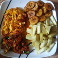 A picture of Fried yam, plantain and egg/sauce.