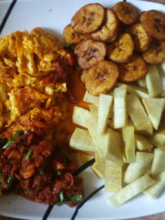 A picture of Fried yam, plantain and egg/sauce.