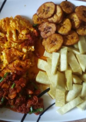 A picture of Fried yam, plantain and egg/sauce.