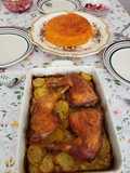 Red rice with chicken legs and potatoes