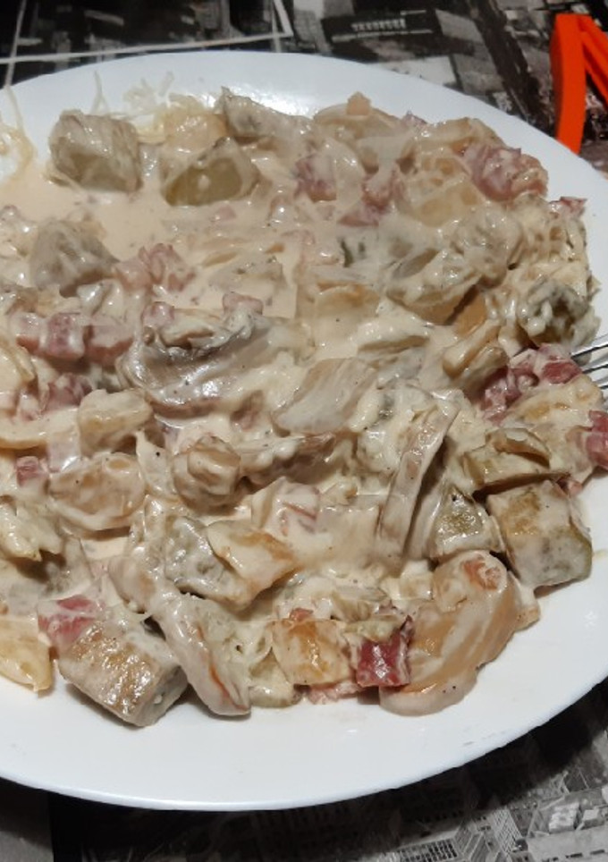 Una foto de Berenjena con jamón y nata
