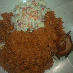 A picture of Jollof rice and chicken.